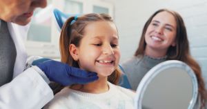 After following The Back-to-School Oral Health Checklist for Parents, this little girl and mother are ready for the school year.
