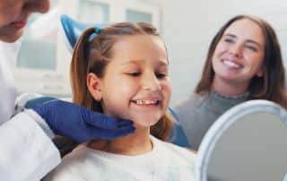 After following The Back-to-School Oral Health Checklist for Parents, this little girl and mother are ready for the school year.